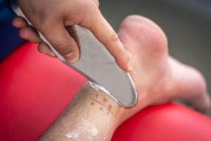 Instrumental mobilization of soft tissues, heel and arch pain treatment